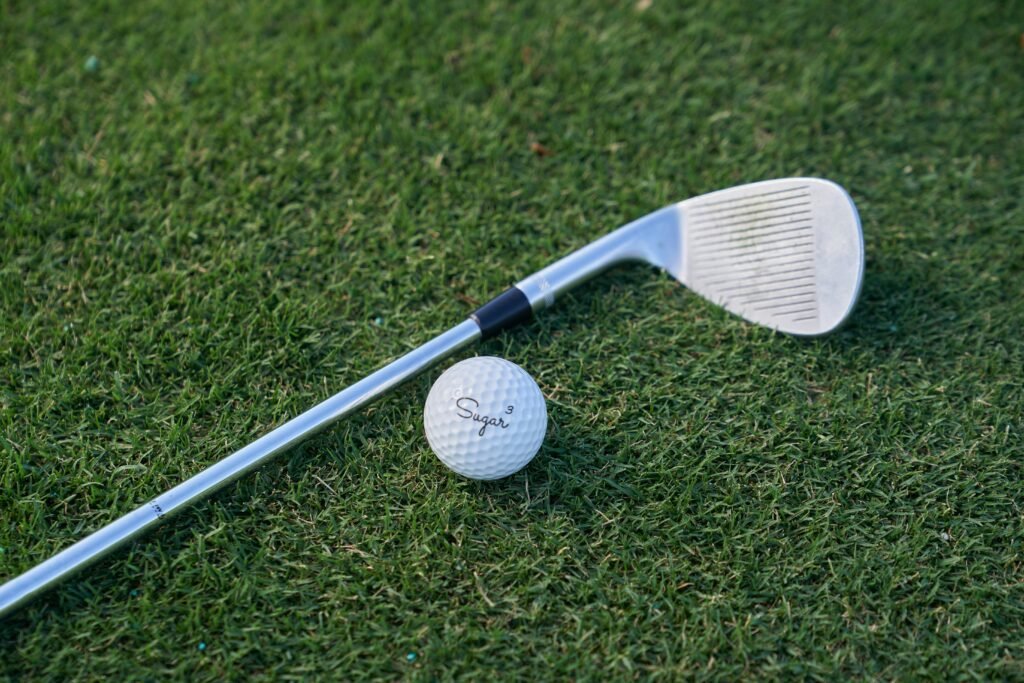 Odyssey White Hot Proputter Grip Mens in use during putting stroke showing stable grip and controlled hand position.