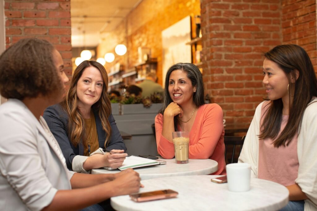 Three people in a throuple discussing communication, relationship goals, and emotional connection.