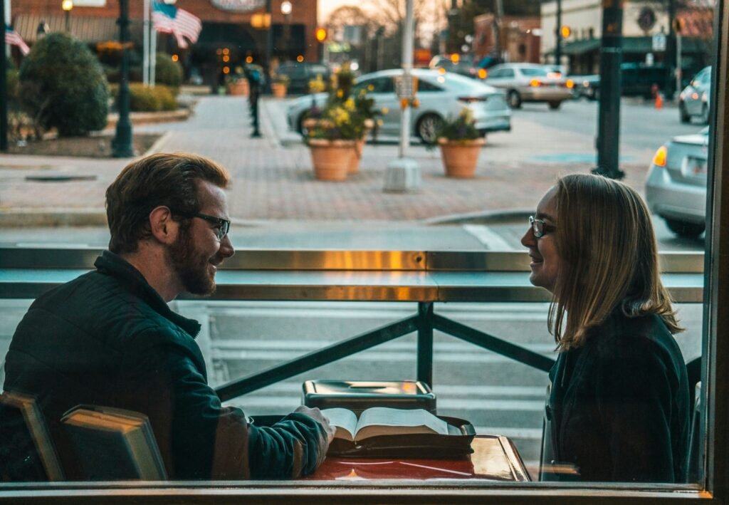 Two people discussing Speed Dating Questions during a dating event.