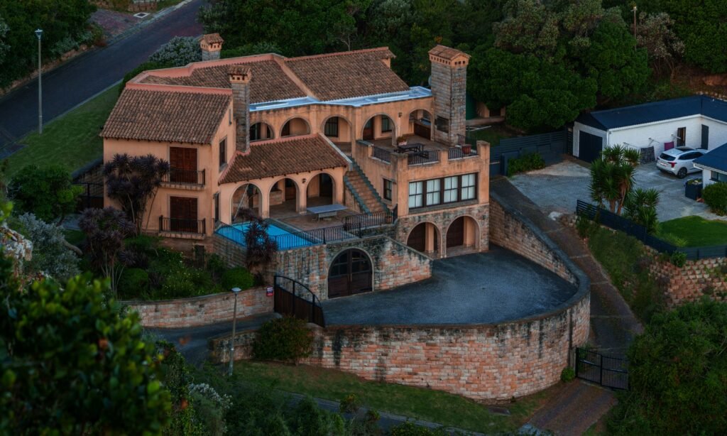 Joel Greenblatt House reflecting privacy, security, and timeless residential architecture.