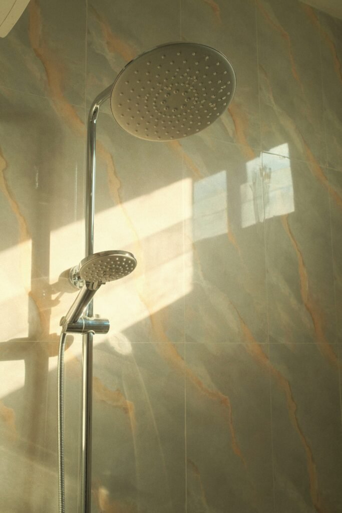 How to Clean Shower Head Vinegar featuring vinegar cleaning, limescale removal, improved water flow, shower head maintenance, and descaling tips.